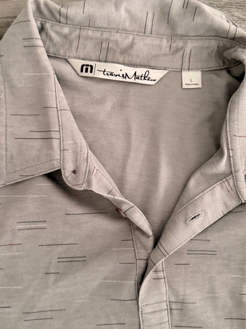 Travis Mathew Men's Light Gray Short-Sleeve Polo with Subtle Stripe Accents